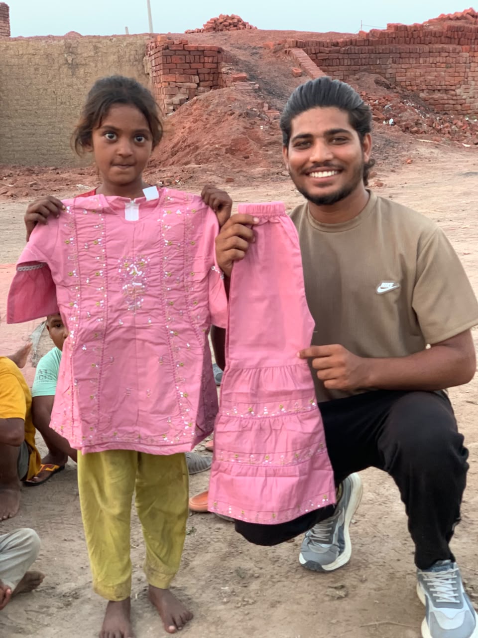 A child receiving new clothes