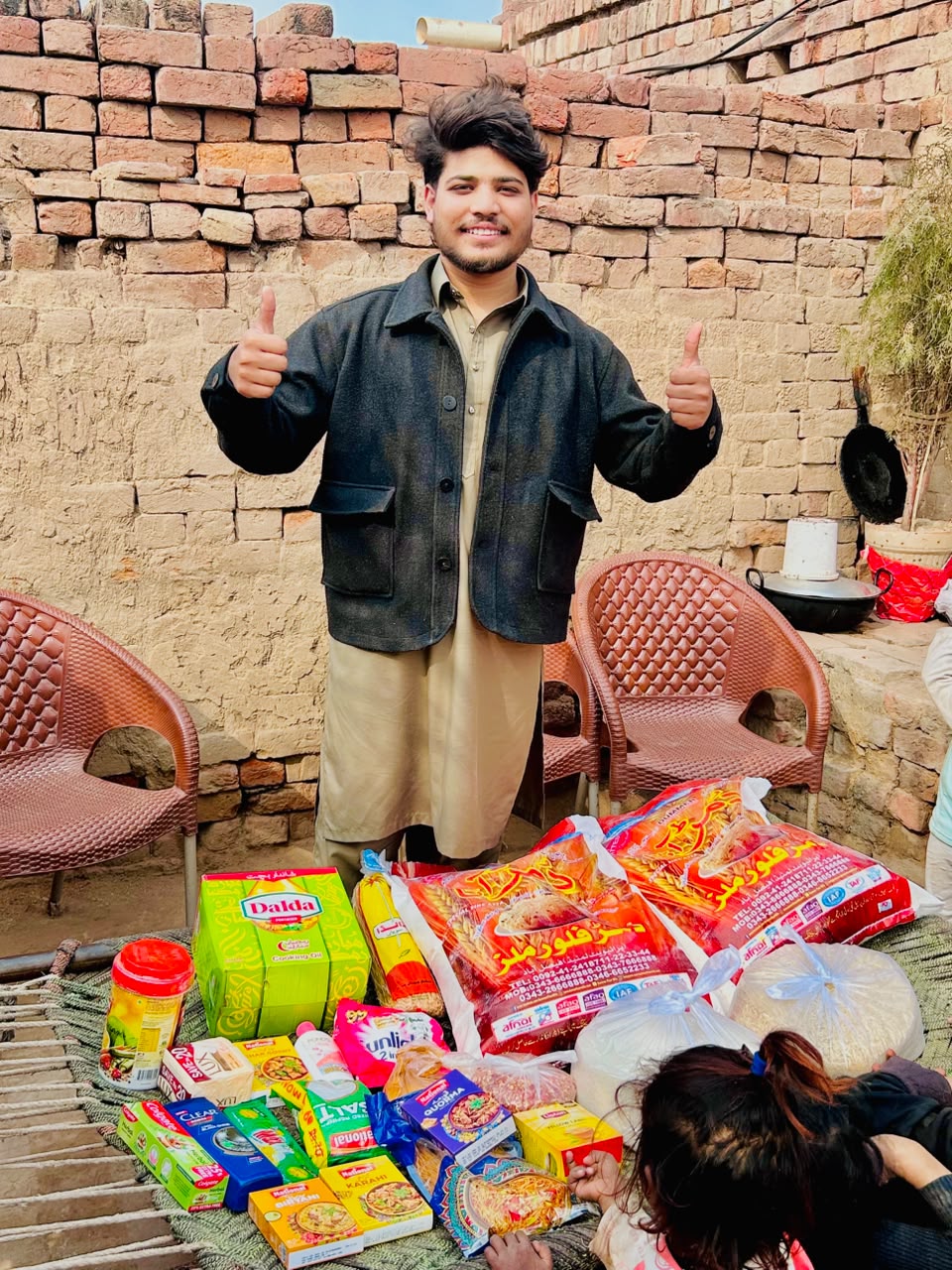 Moheeb Ashraf with food supplies